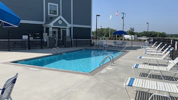 Seasonal outdoor pool, open 9:00 AM to 9:00 PM, pool loungers
