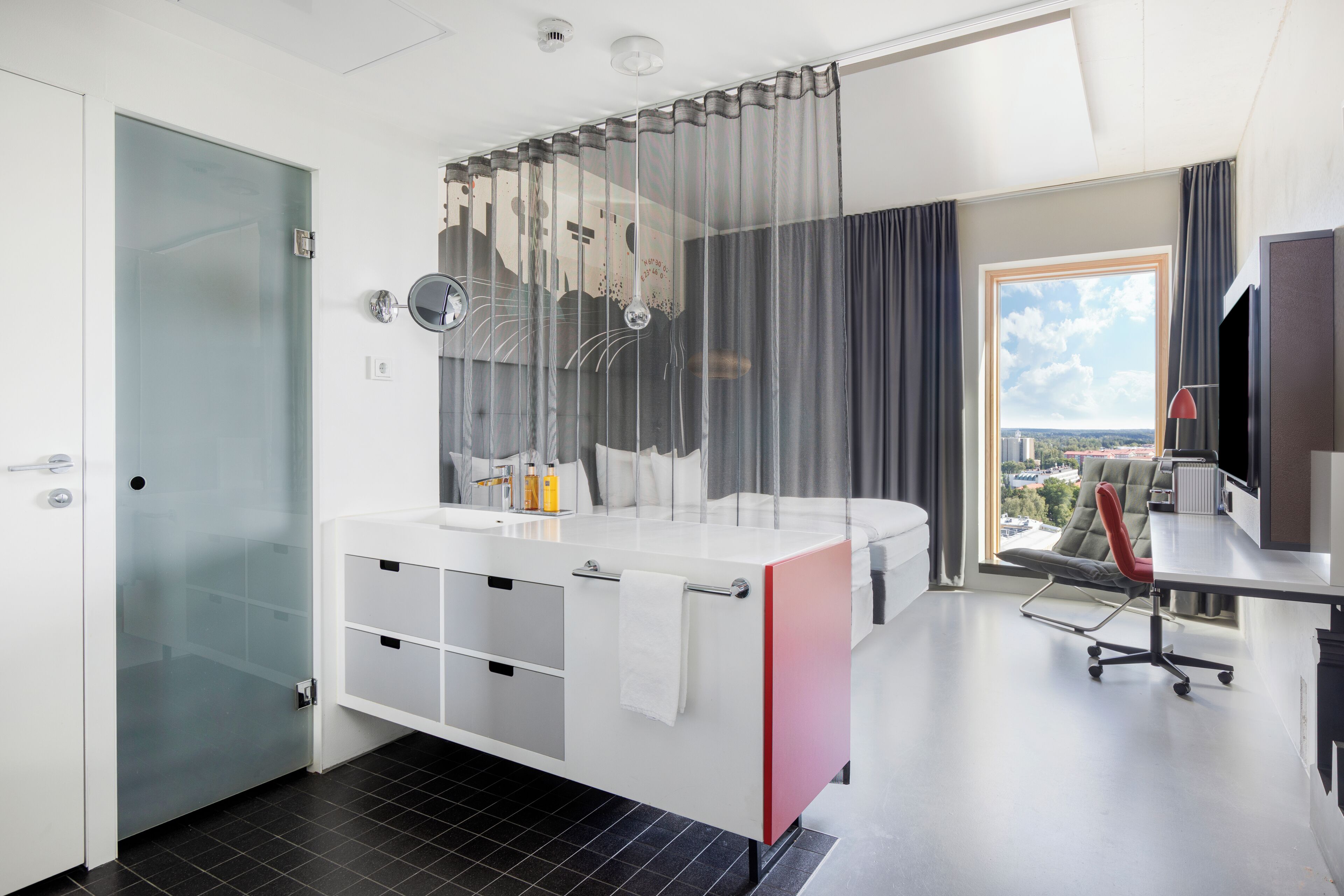 Twin Room (Solo Up) | Minibar, in-room safe, individually decorated, desk