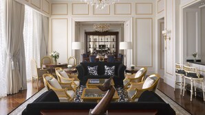 A luxurious living room with a chandelier, elegant furniture, and a wine rack in the background. - The Castle Hotel, a Luxury Collection Hotel, Dalian (Dalian)