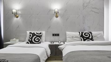 A hotel room with two beds, marble walls, and wall-mounted lamps.