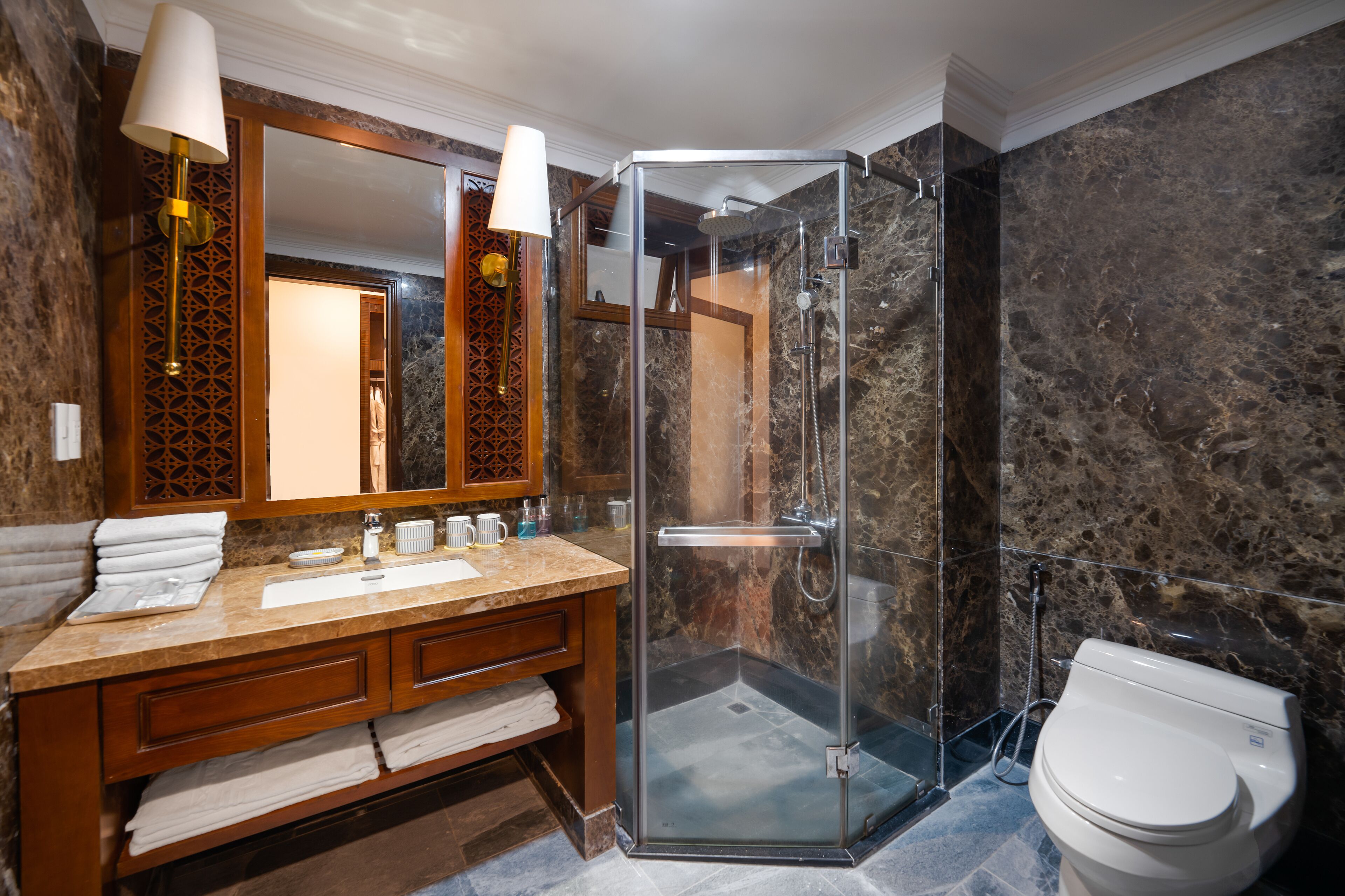 luxury penthouse | bathroom | hair dryer, bathrobes, slippers, towels