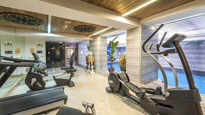 A modern gym with treadmills, elliptical machines, and weight equipment. - Yasmak Comfort Hotel (Istanbul)