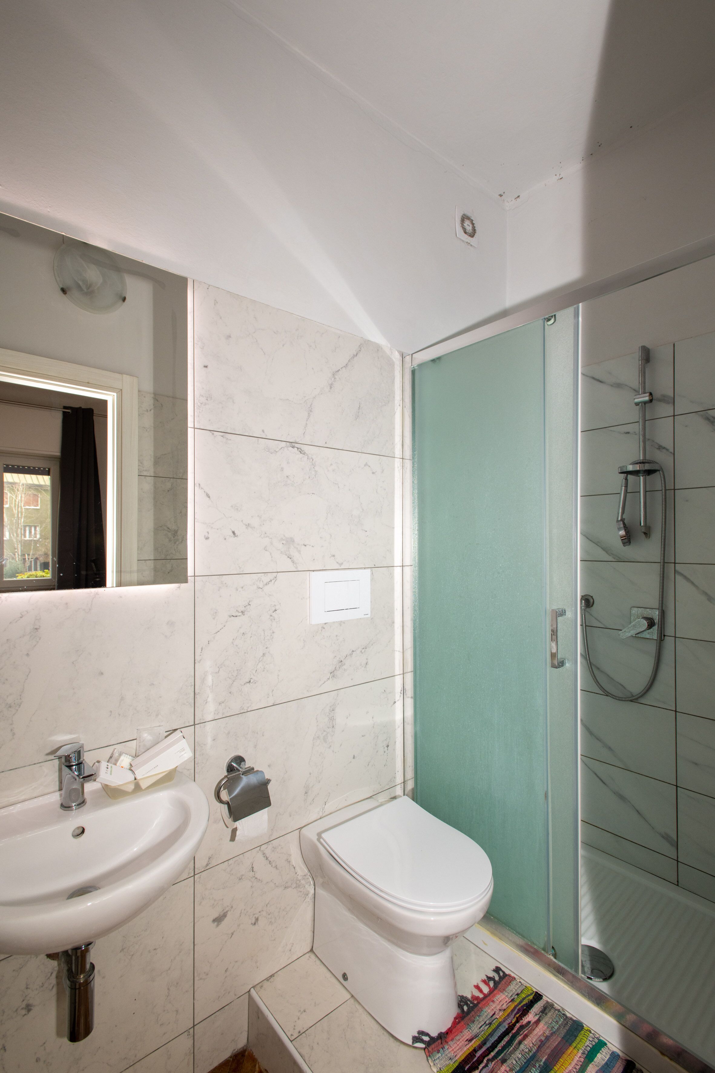 Shower, rainfall showerhead, hair dryer, towels