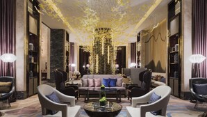 A luxurious lobby with a central seating area, high ceilings, and modern decor. - Wanda Realm Changzhou (Changzhou)