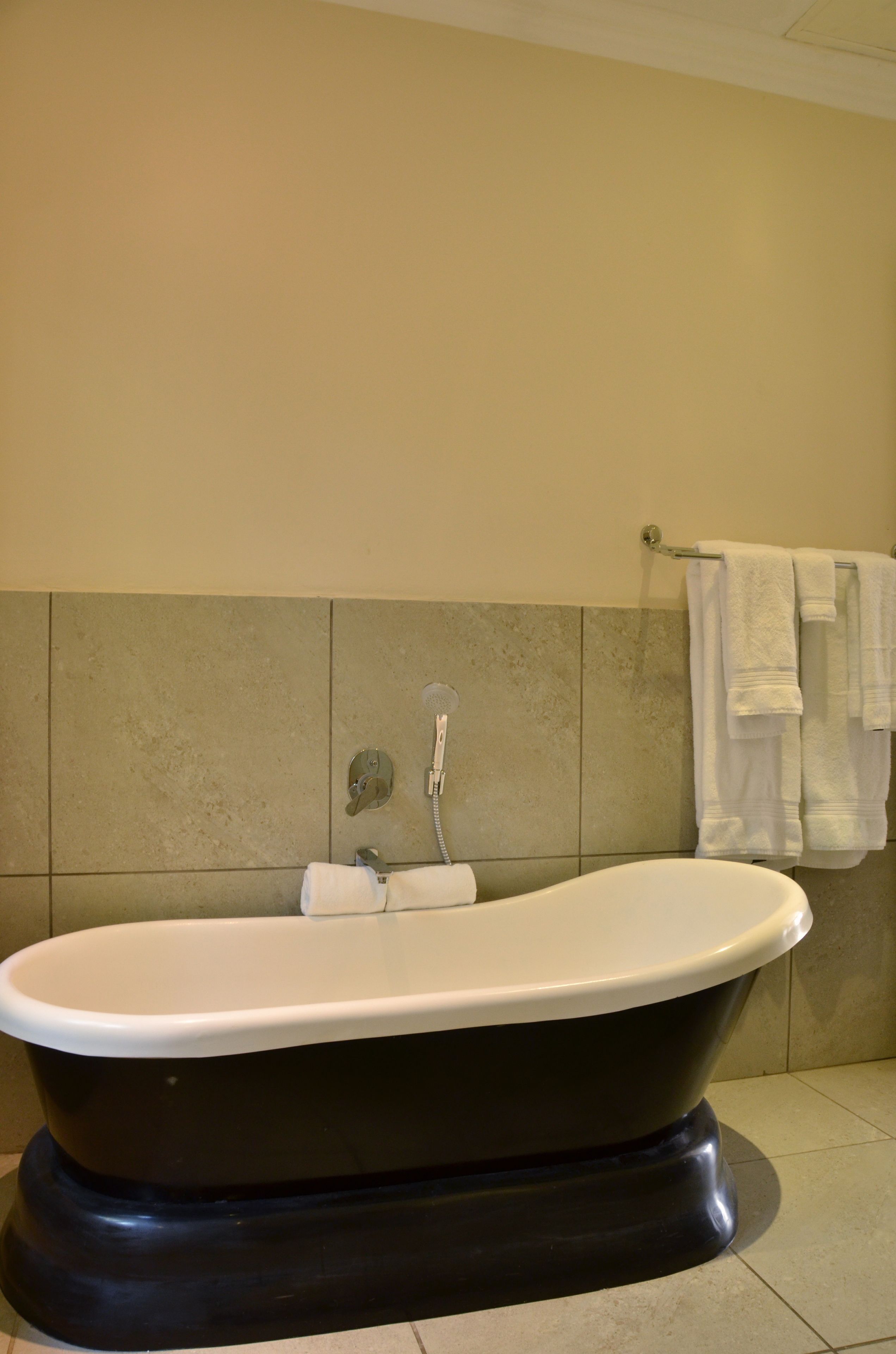 executive suite, 2 bedrooms, garden view | bathroom | separate bathtub and shower, designer toiletries, hair dryer, bathrobes