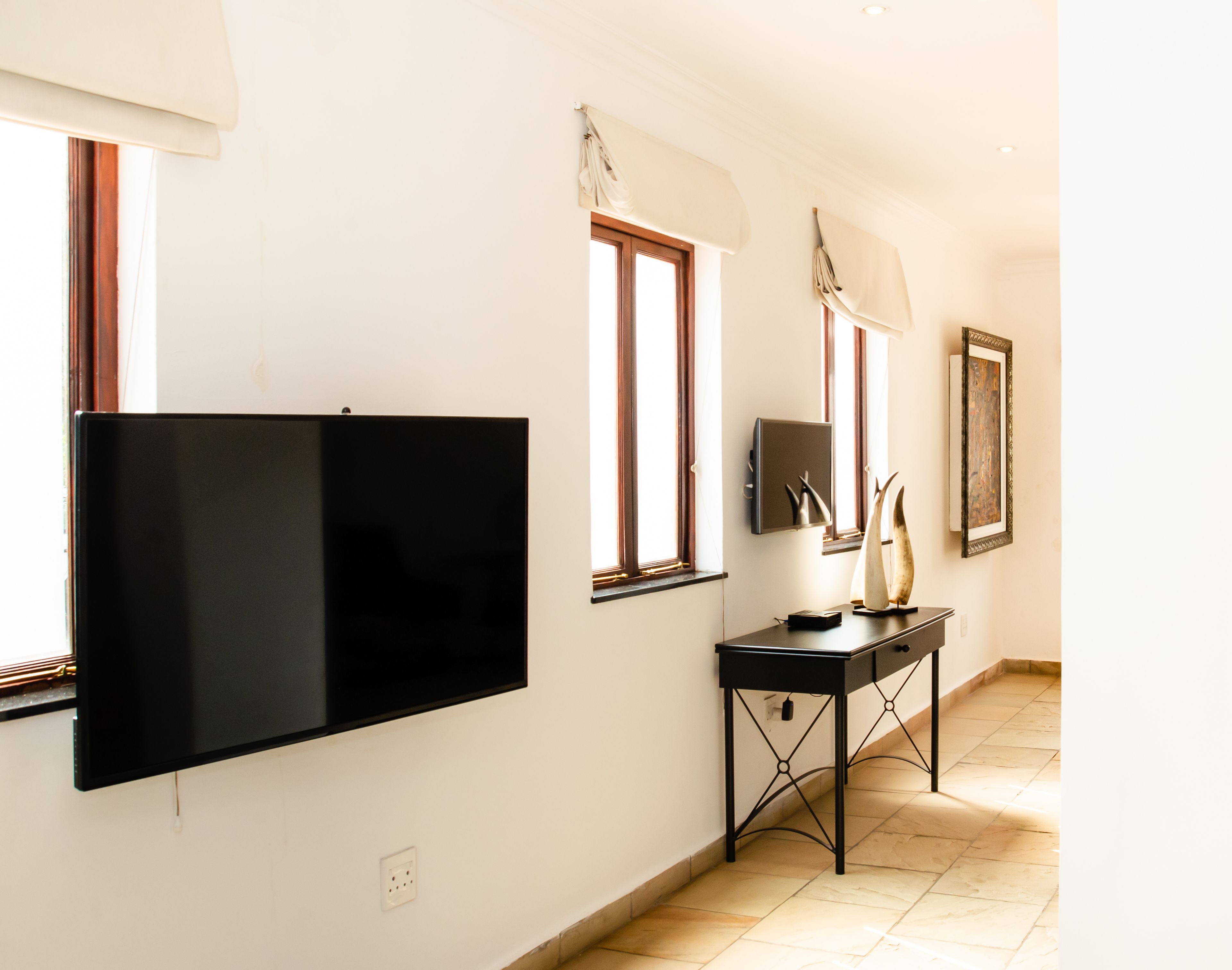 luxury suite, 1 bedroom, ground floor | living area | 42-inch lcd tv with satellite channels, tv