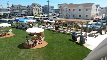 Enjoy al fresco dining and socializing in this inviting outdoor patio area with comfortable seating and a shaded pergola.