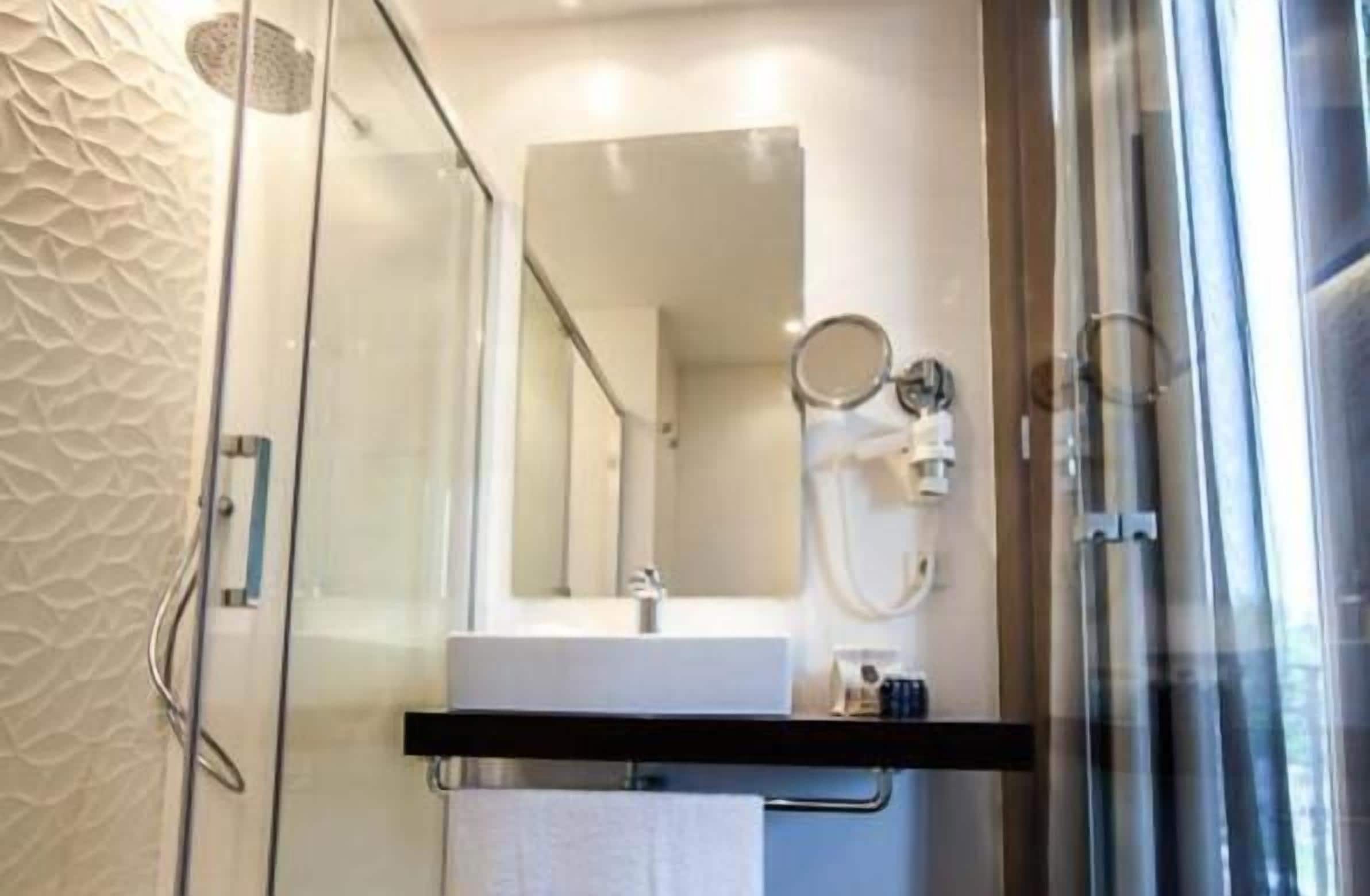 shower, rainfall showerhead, designer toiletries, hair dryer