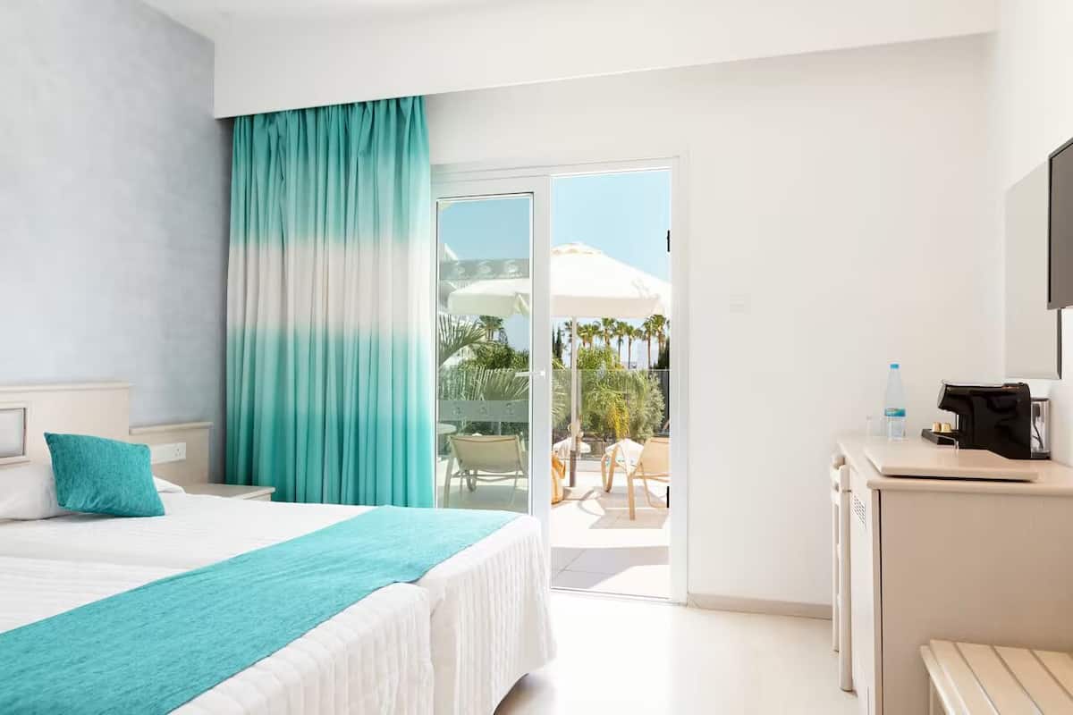 superior room, pool view | 1 bedroom, in-room safe, desk, laptop workspace