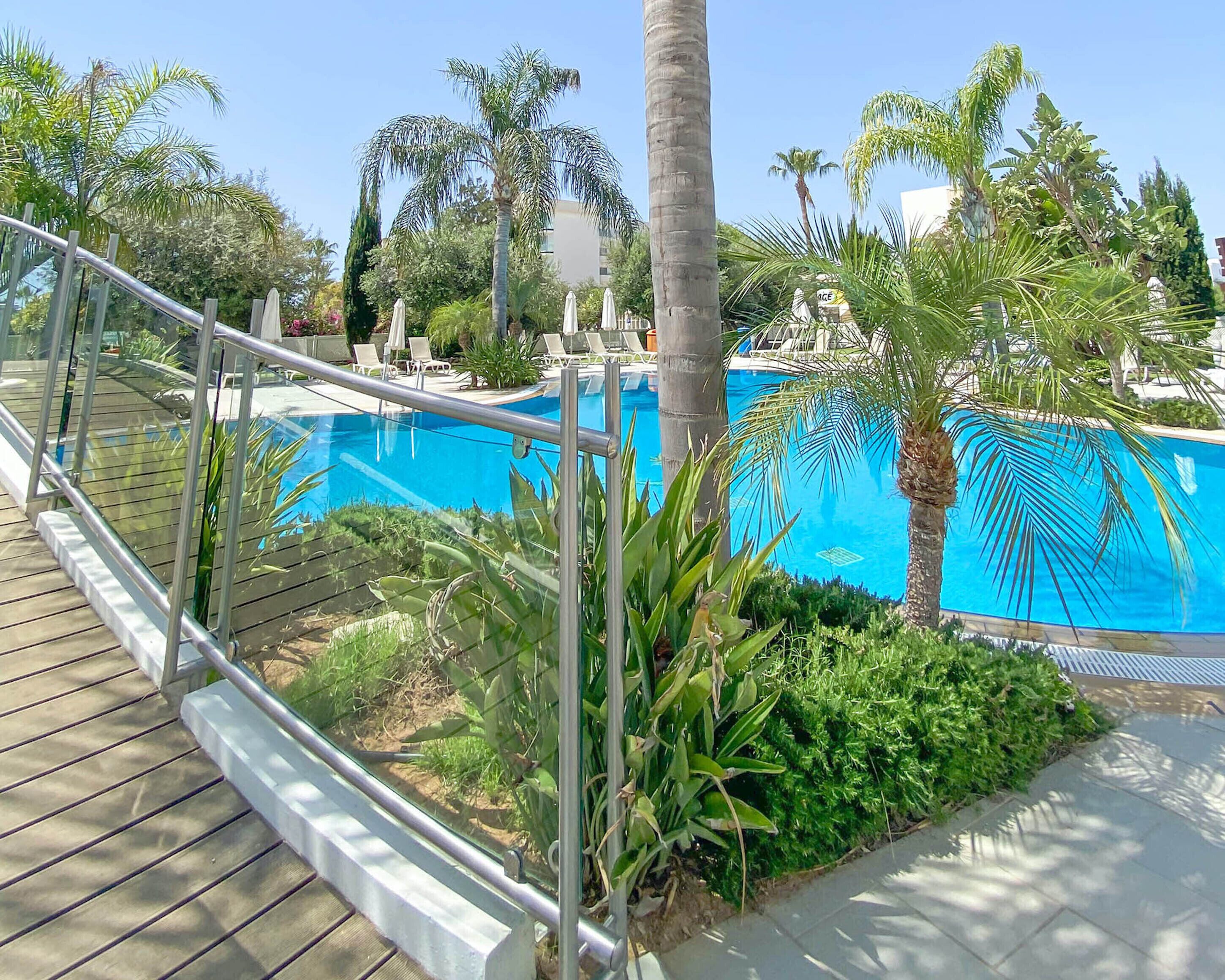 outdoor pool, pool umbrellas, pool loungers