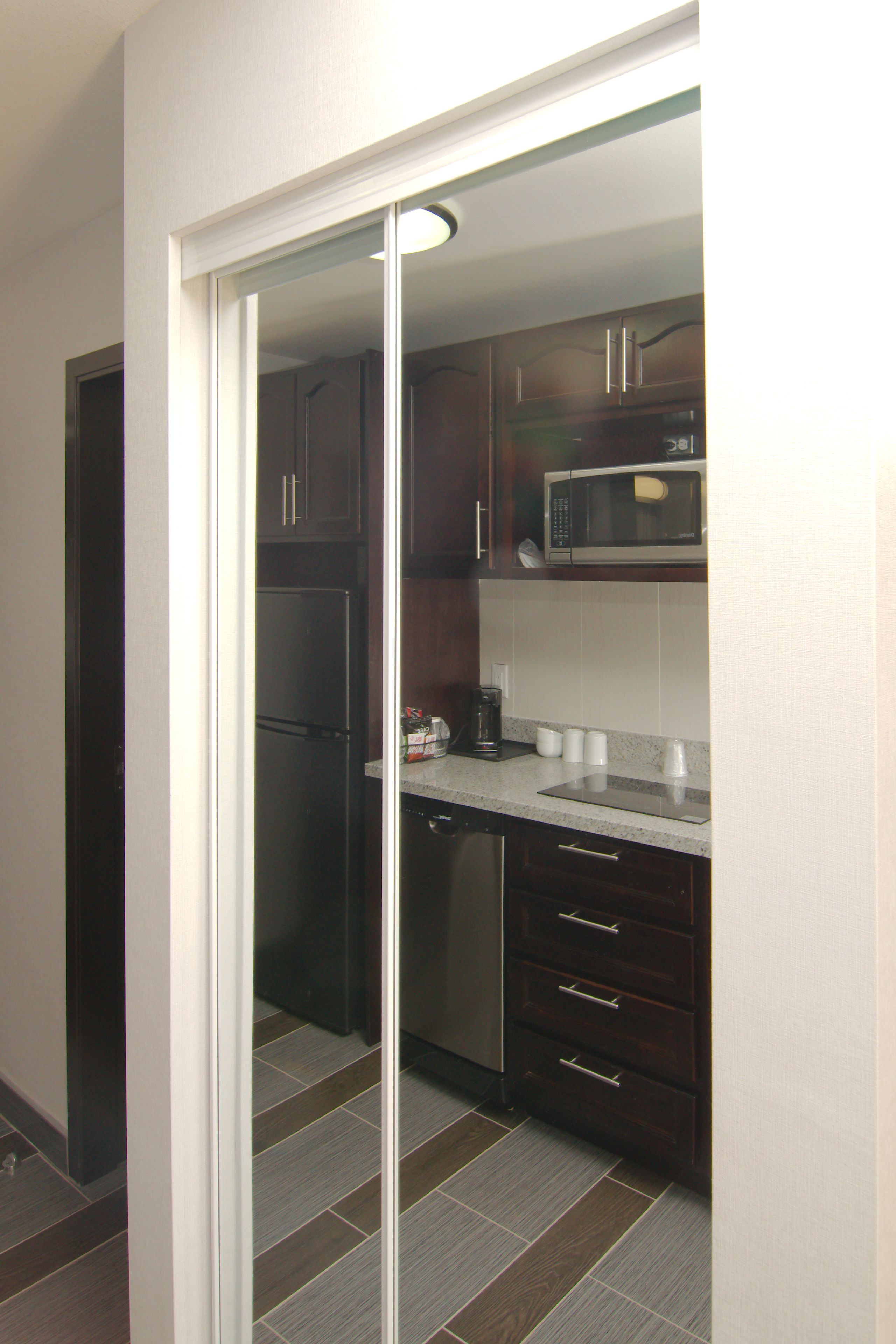 full-sized fridge, microwave, stovetop, dishwasher