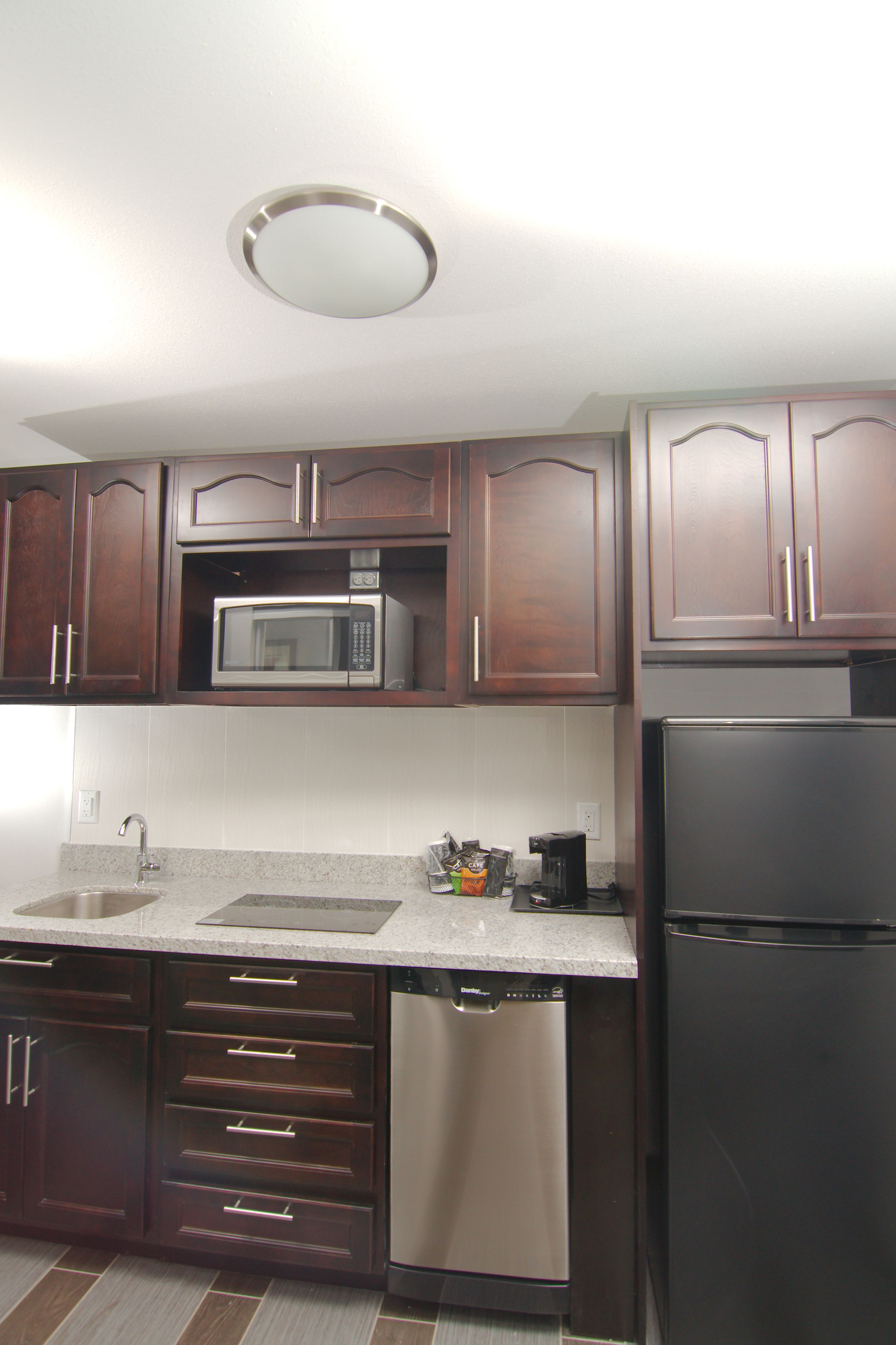 full-sized fridge, microwave, stovetop, dishwasher