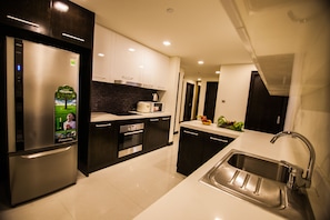 Three Bedrooms Grand Suite | Private kitchen | Fridge, microwave, oven, stovetop