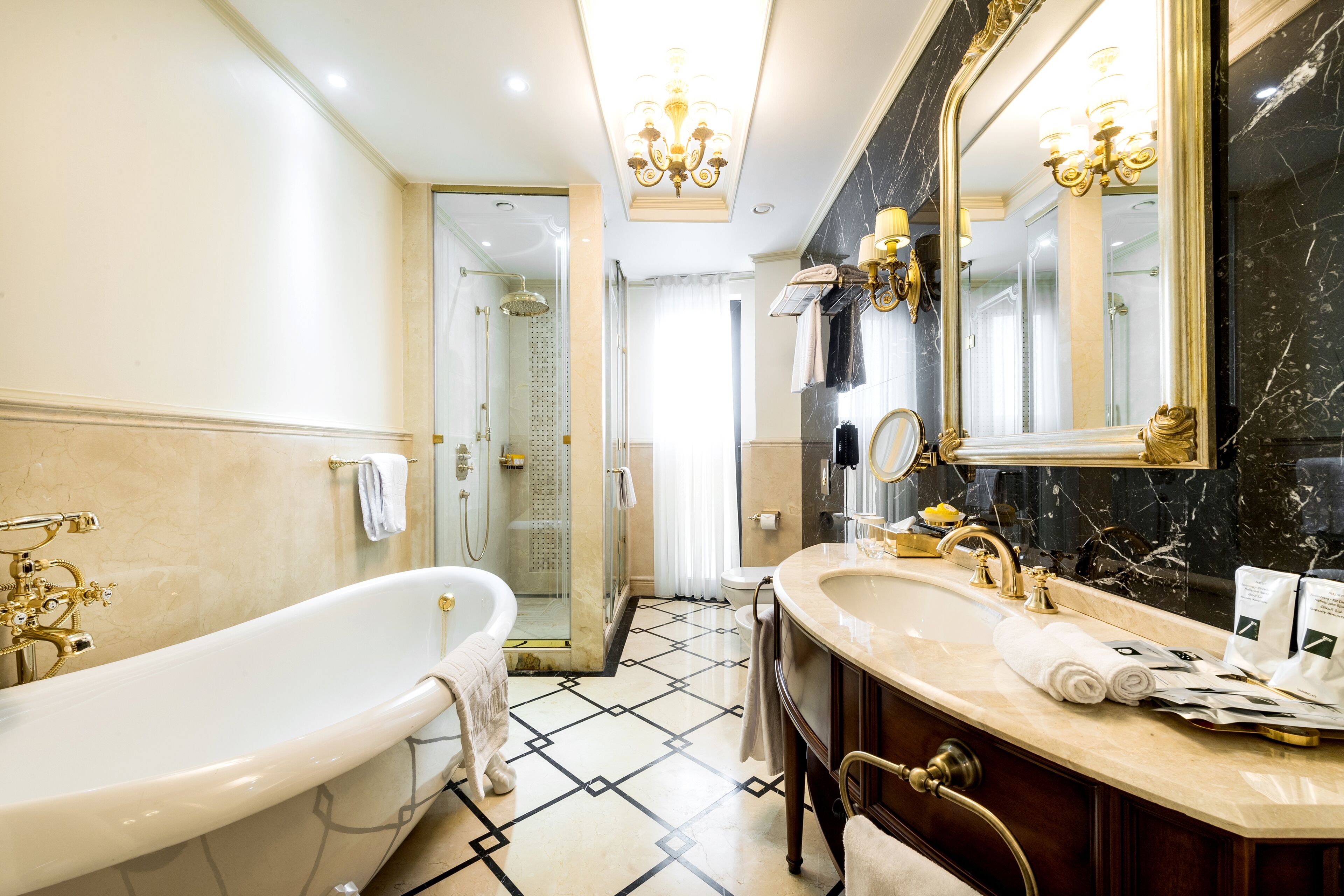 exclusive suite, 1 king bed | bathroom | rainfall showerhead, designer toiletries, hair dryer, bathrobes