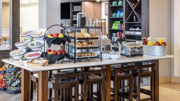 A breakfast buffet with various food items and beverages. - Hilton Garden Inn Roanoke (Roanoke)