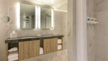 Shower, designer toiletries, hair dryer, towels