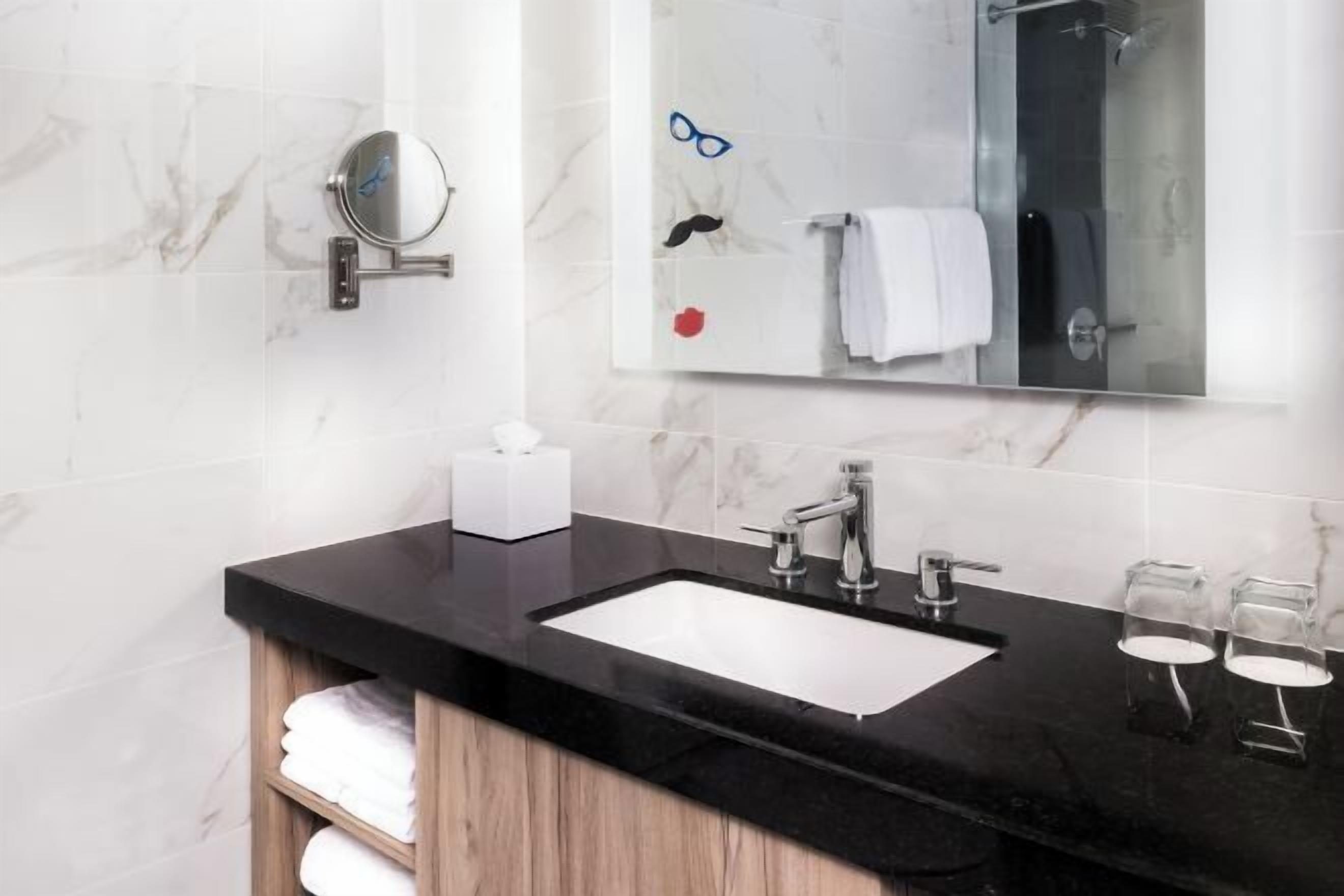 Shower, designer toiletries, hair dryer, towels