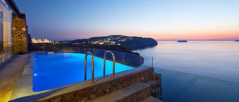 Outdoor pool, an infinity pool, sun loungers