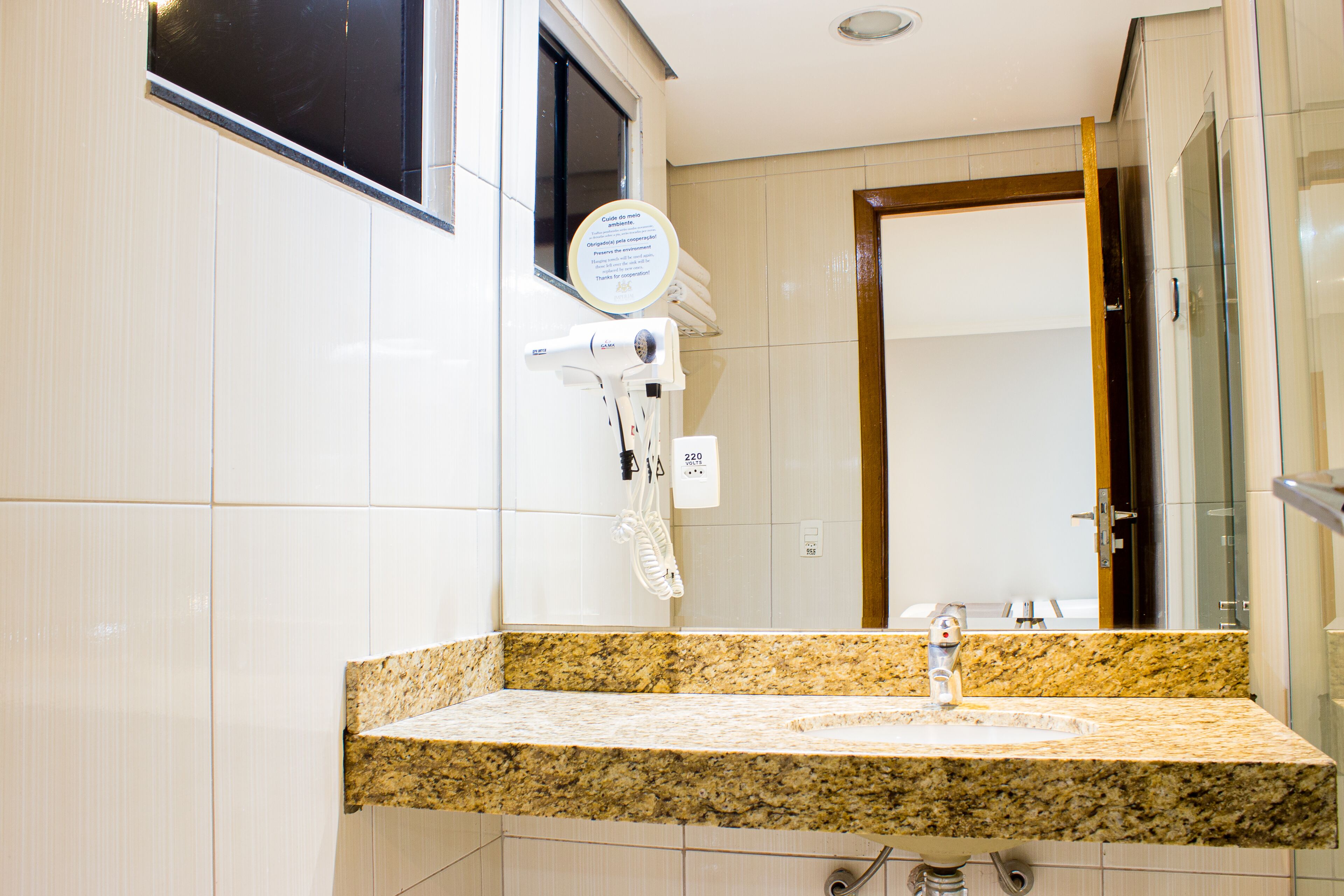 shower, designer toiletries, hair dryer, towels