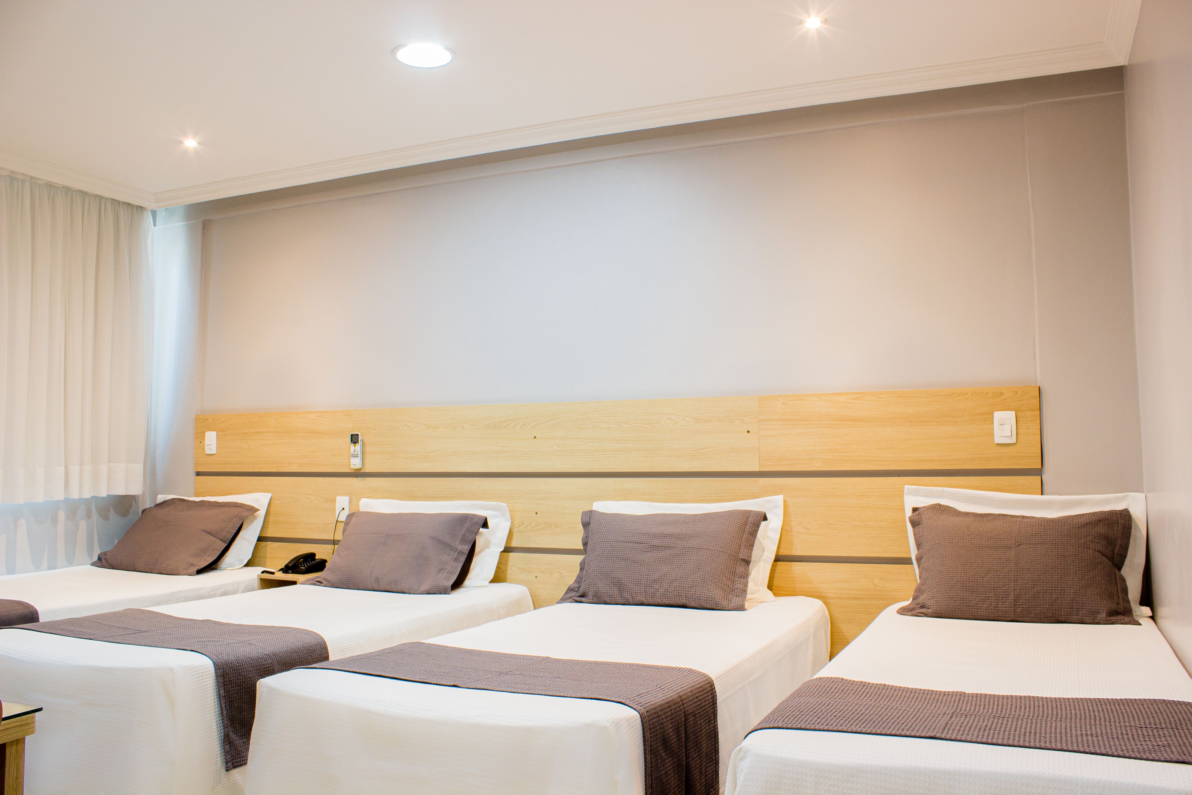 deluxe quadruple room | 1 bedroom, select comfort beds, minibar, individually decorated