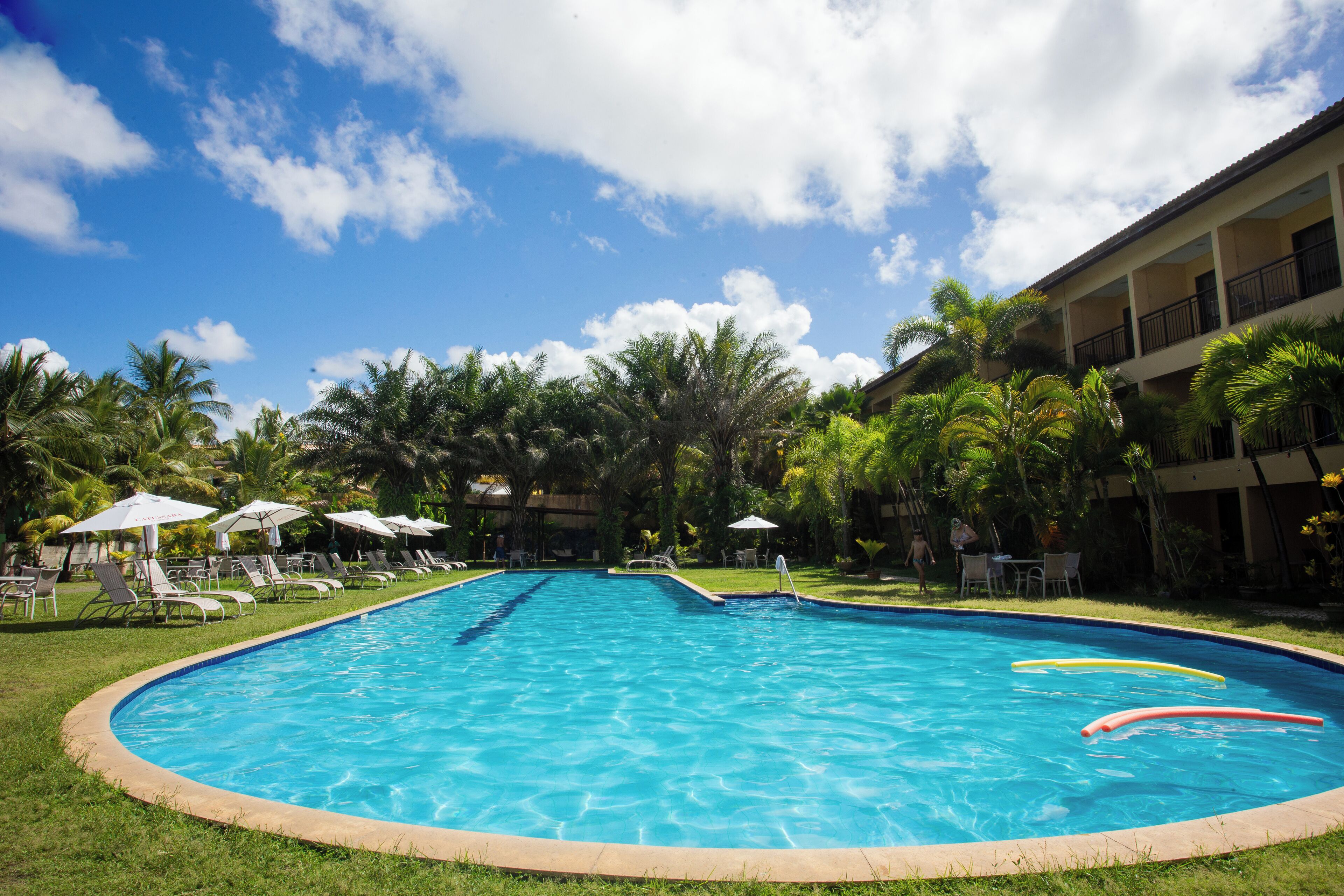 outdoor pool, pool umbrellas, pool loungers