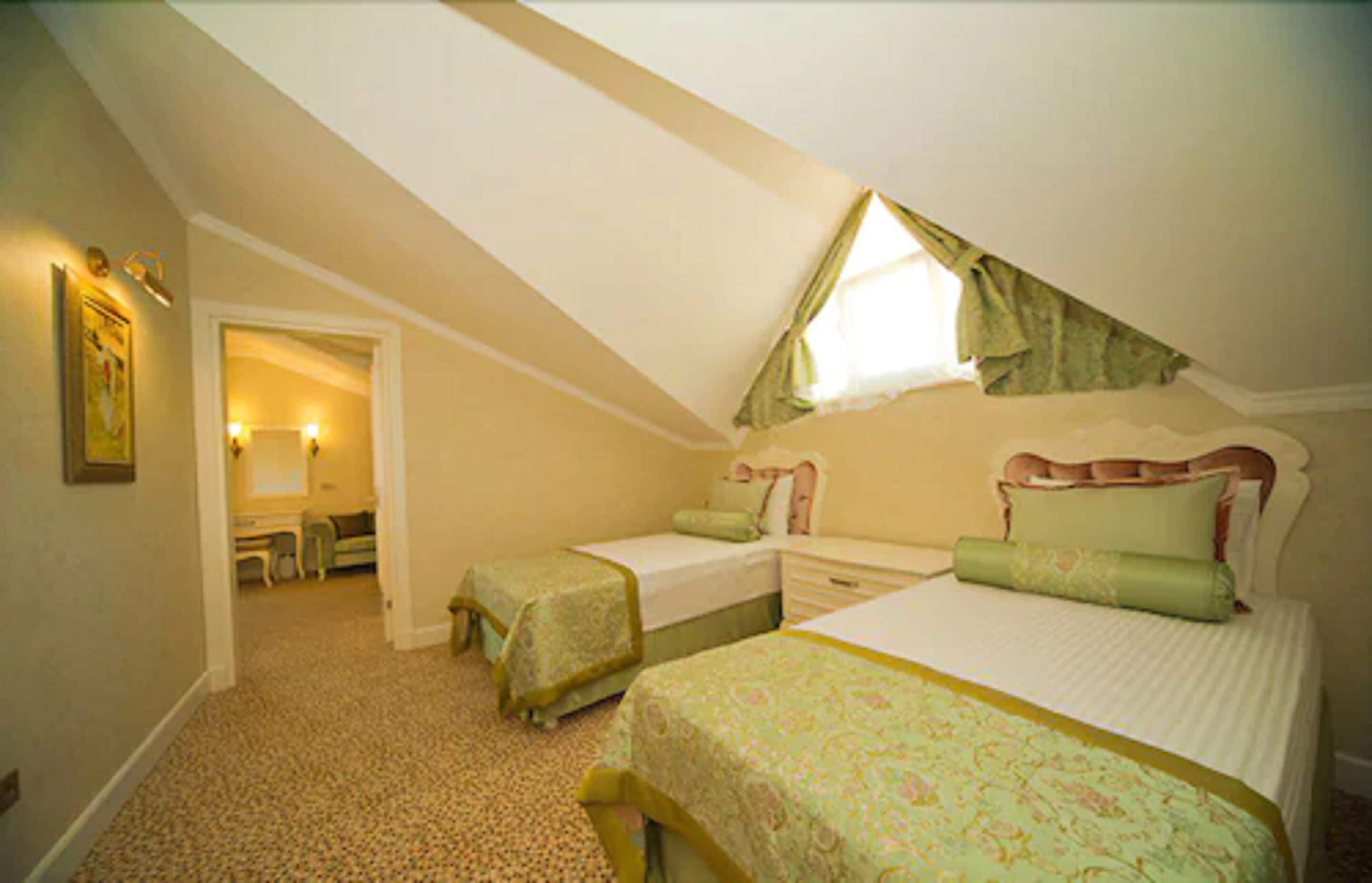 family room | 1 bedroom, minibar, in-room safe, desk