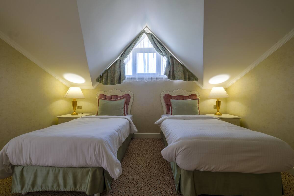 family room | 1 bedroom, minibar, in-room safe, desk