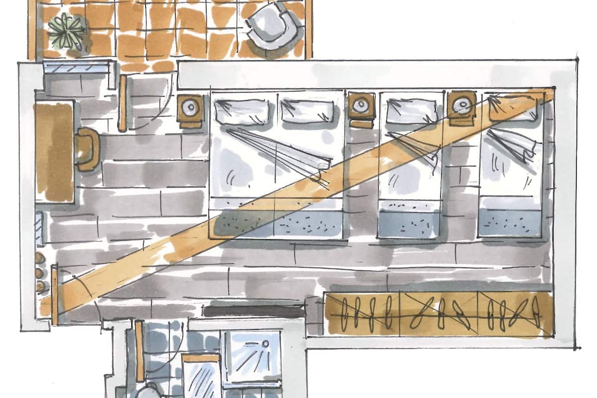 A kitchen layout with a central island, a sink, and a stove. There is a small dining area with a table and chairs.