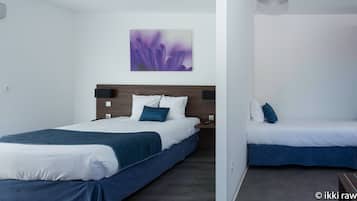 A modern hotel room with a large bed, a smaller bed, and a painting on the wall.