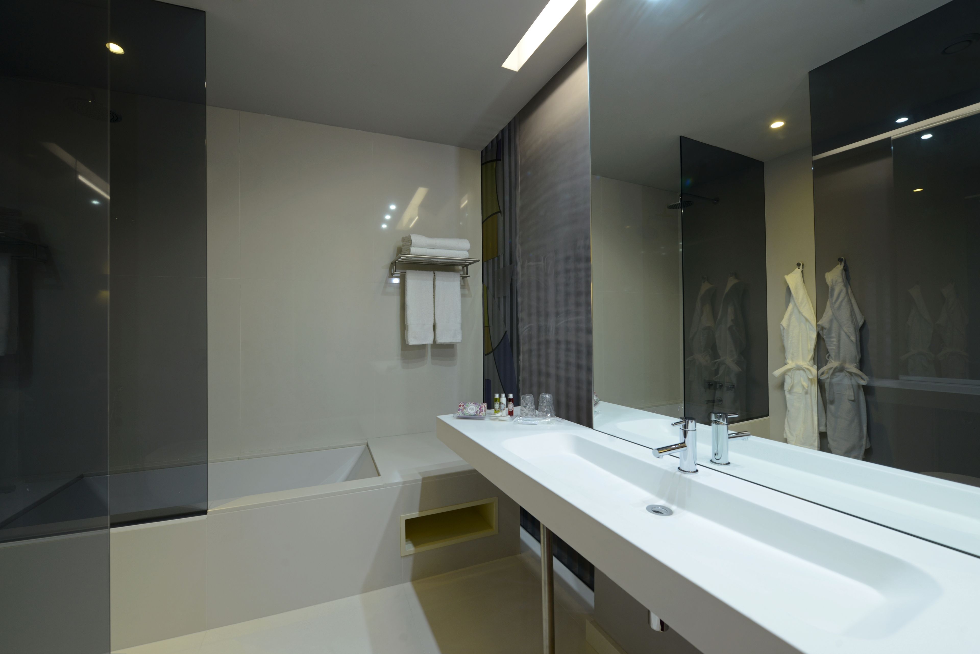 superior double or twin room | bathroom | rainfall showerhead, free toiletries, hair dryer, bathrobes