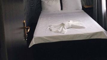 Frette Italian sheets, down duvets, pillow-top beds, desk