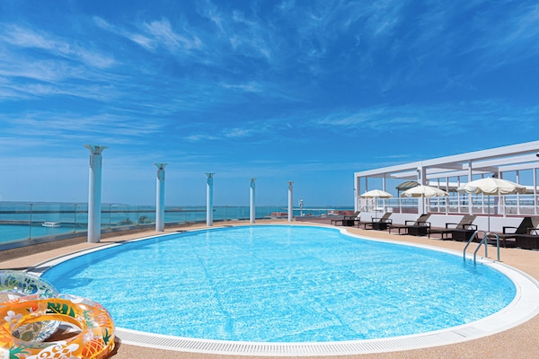 Seasonal outdoor pool, open 8:00 AM to 10:00 PM, pool umbrellas