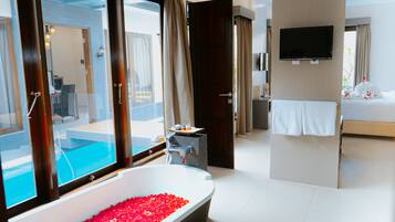 Honeymoon Villa | Bathroom | Shower, rainfall showerhead, hair dryer, slippers