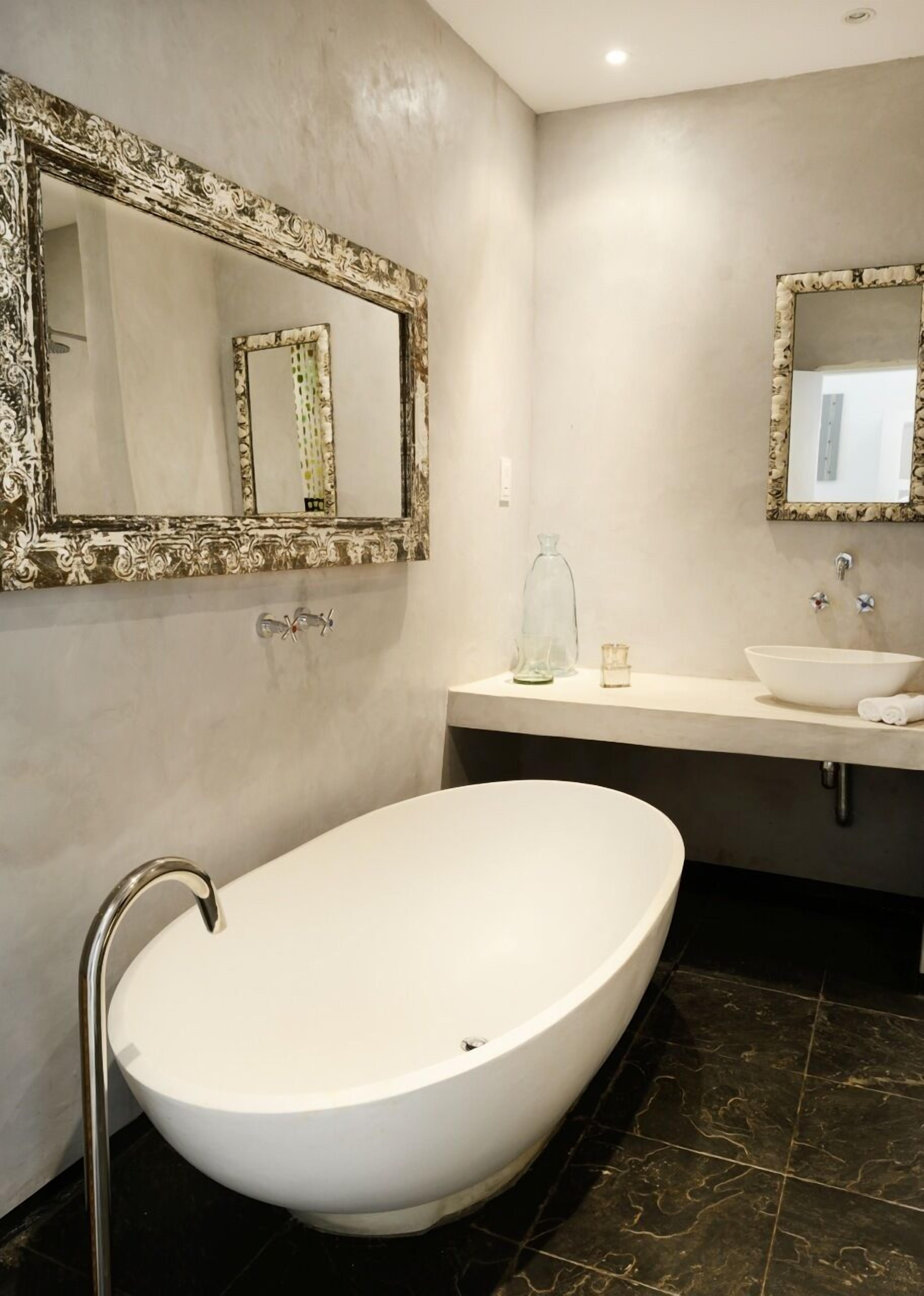 designer toiletries, hair dryer, bathrobes, slippers