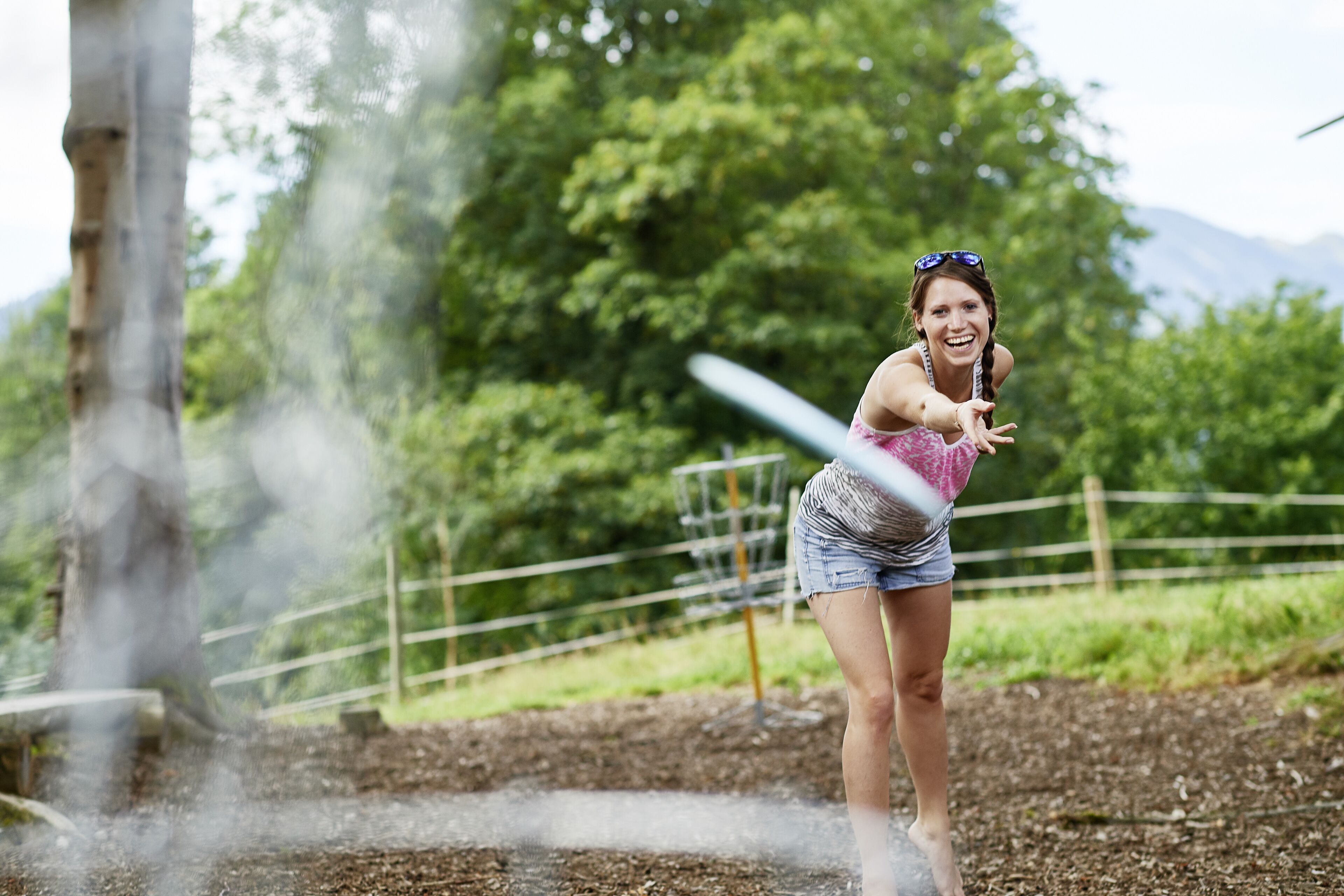 A person playing a game with a water fountain.