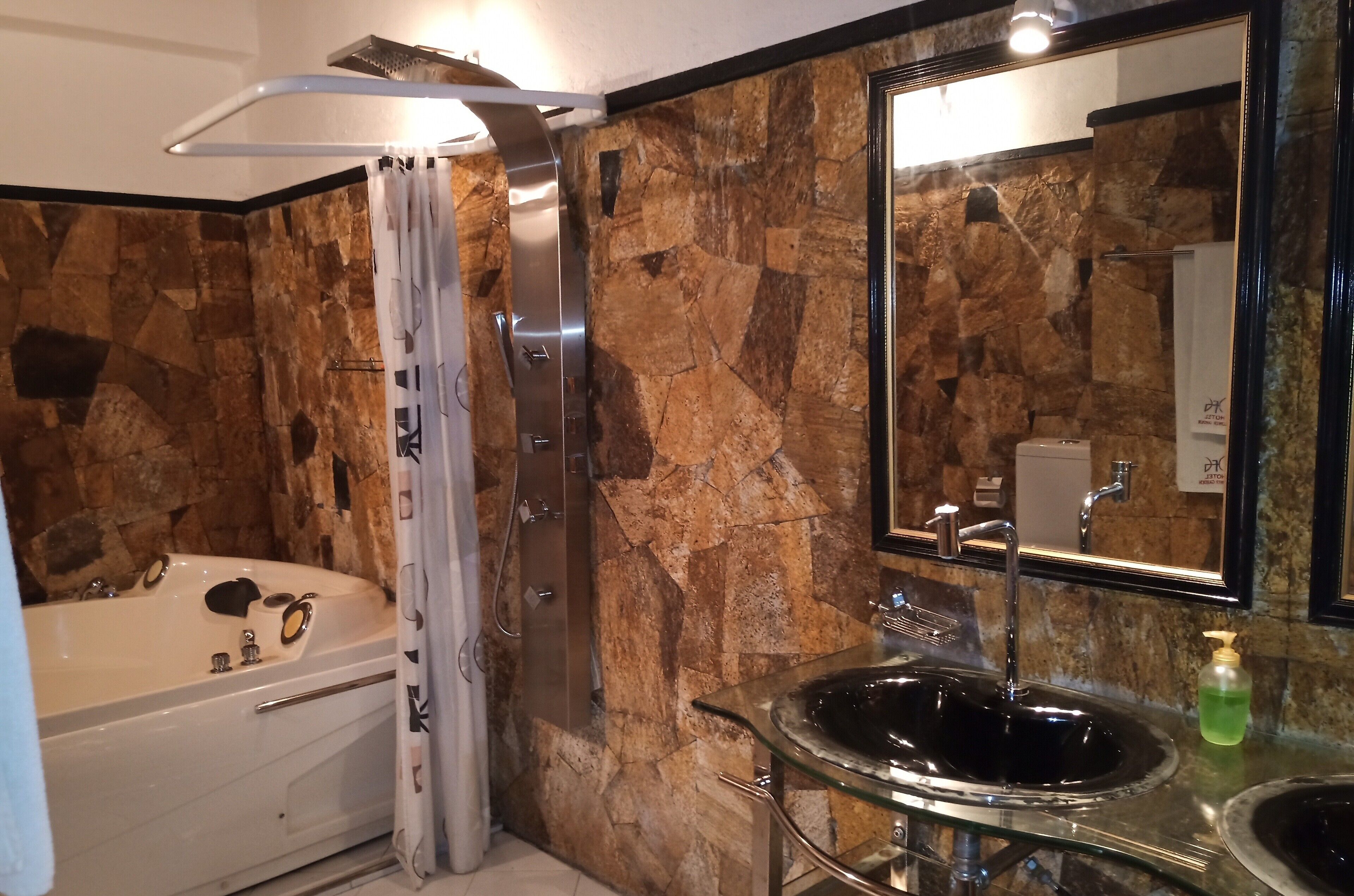 super deluxe cabana | bathroom | shower, free toiletries, hair dryer, towels