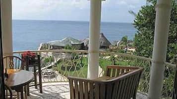 Deluxe Suite, 1 Bedroom, Ocean View (Upper Floor, Aries) | 1 bedroom, in-room safe, individually decorated, individually furnished