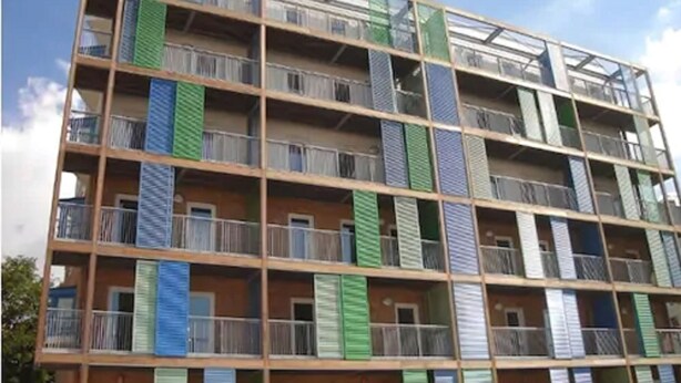 A multi-story building with balconies, each with a different color scheme. - Citystay Living - Warren Close (Cambridge)