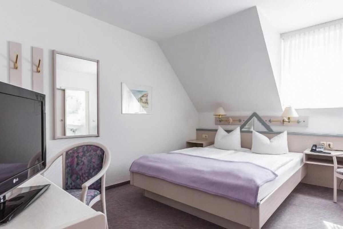 Desk, blackout drapes, WiFi (free), bed sheets