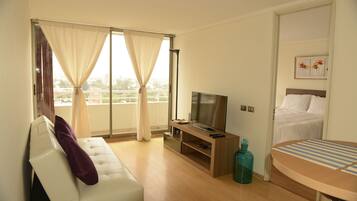 Apartment, 1 Bedroom (I) | Living area | 40-inch LED TV with cable channels, TV