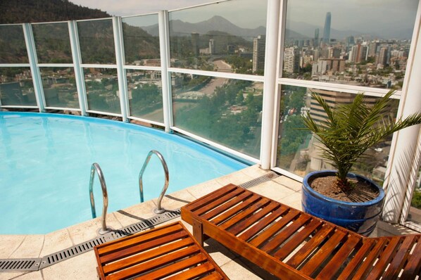 Outdoor pool, a rooftop pool, pool loungers