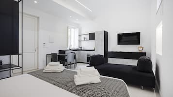 Suite estudio ejecutiva | 1 habitación, ropa de cama de alta calidad, edredón y minibar