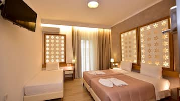 Superior Triple Room | Minibar, in-room safe, desk, soundproofing
