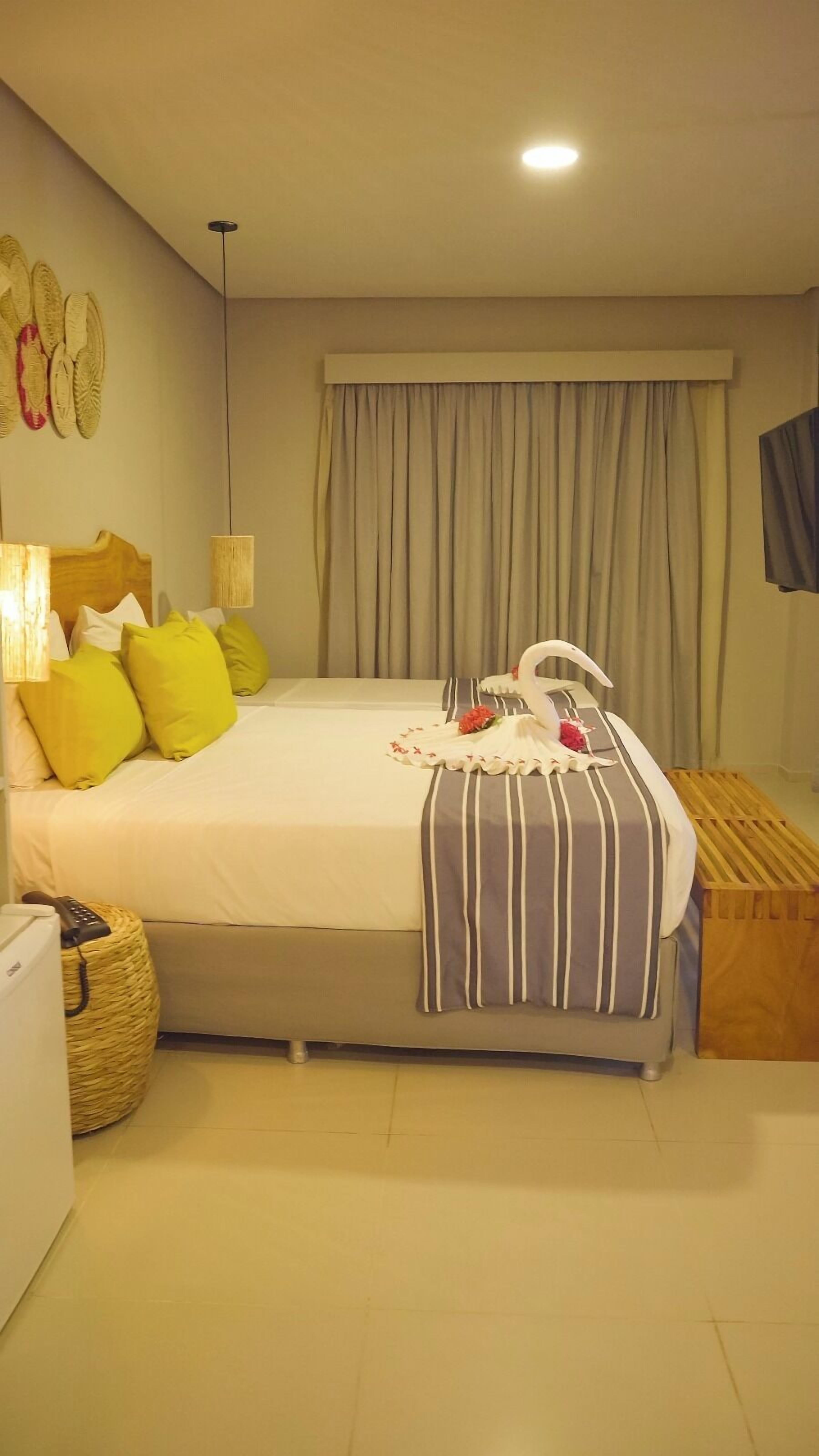 Senior Quadruple Room | Minibar, in-room safe, laptop workspace, blackout drapes