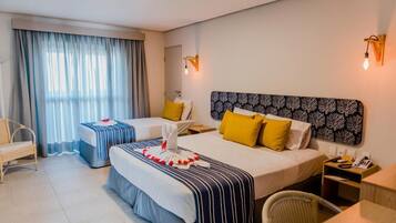 Deluxe Room | Minibar, in-room safe, laptop workspace, blackout drapes