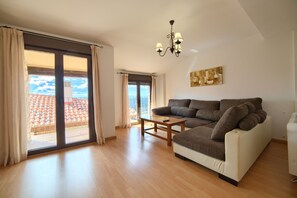 Comfort Apartment, 1 Bedroom | Living area | Flat-screen TV - Apartamentos Rurales Sierra de Gudar (Gudar)