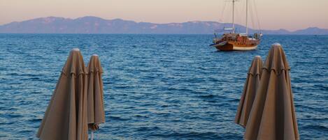 On the beach, sun loungers, beach umbrellas, beach towels