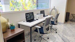 A modern office cubicle with a desktop computer, a printer, and office chairs. - Holiday Inn Express Culiacan by IHG (Culiacán)