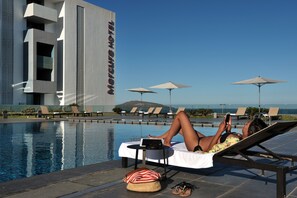 Indoor pool, outdoor pool, open 10:00 AM to 9:00 PM, pool umbrellas