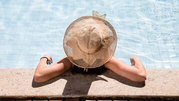 Indoor pool, outdoor pool, pool umbrellas, pool loungers